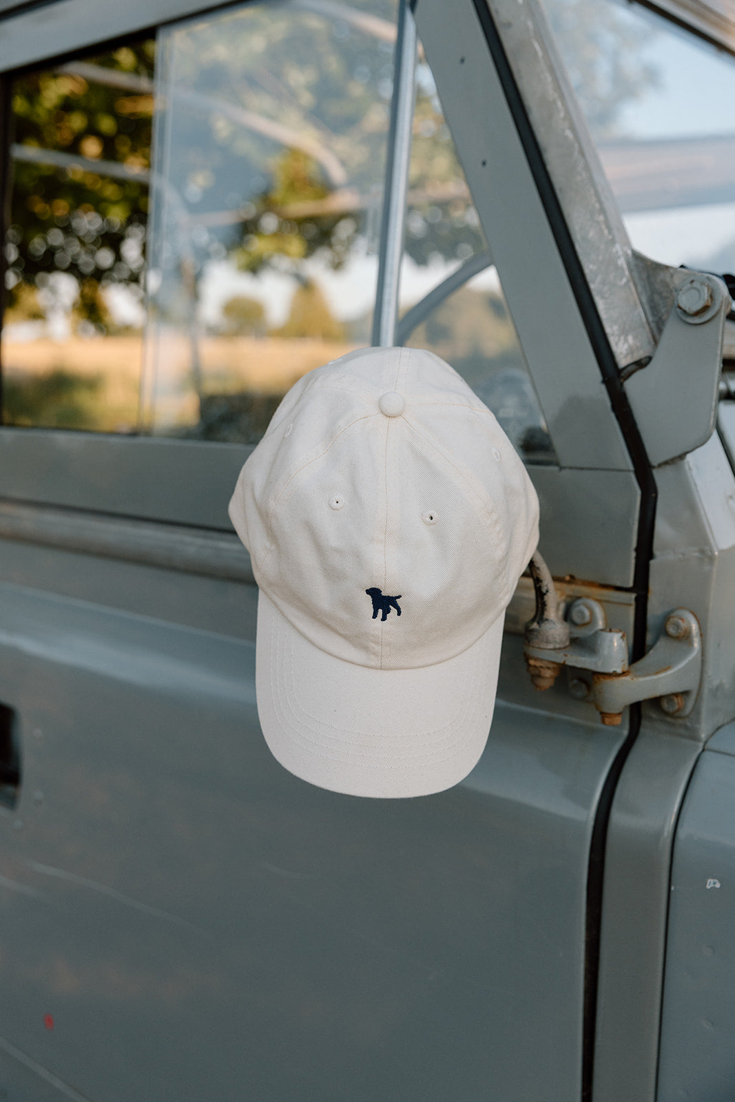 Kilpeck Adjustable Cream Cap With Navy Dog